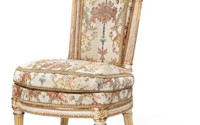 A Louis XVI Carved, White Painted, and Parcel-Gilt Chaise, Circa 1775