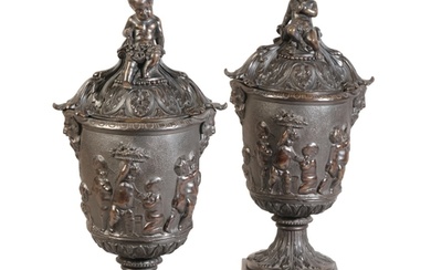 A MATCHED PAIR OF LARGE PATINATED BRONZE URNS WITH COVERS l...