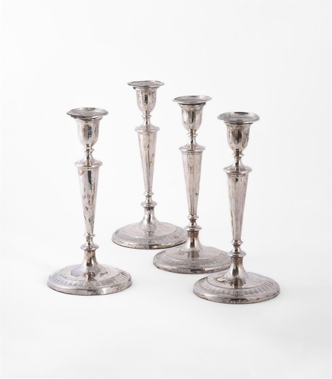 A MATCHED SET OF FOUR GEORGE III SILVER CANDLESTICKS