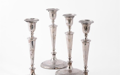 A MATCHED SET OF FOUR GEORGE III SILVER CANDLESTICKS