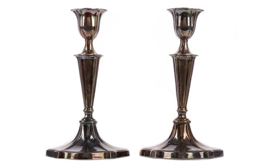 A PAIR OF EDWARDIAN SILVER CANDLE STICKS