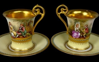 A PAIR OF JEWELLED DRESDEN CUP AND SAUCERS