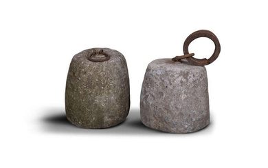 A PAIR OF LIMESTONE WEIGHTS, of barrel form, with...