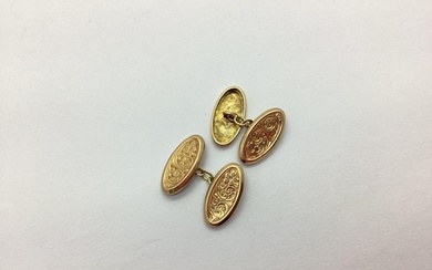 A Pair of 9ct Gold Cufflinks, the foliate engraved oval pane...