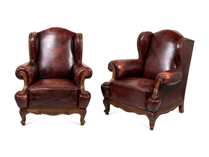 A Pair of Rococo Revival Leather-Upholstered Wingback Armchairs