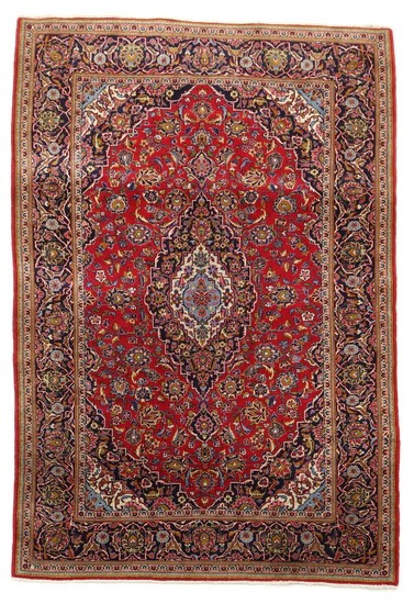 A Persian Keshan rug, classic medallion design on red base. 20th century. 211×136 cm.