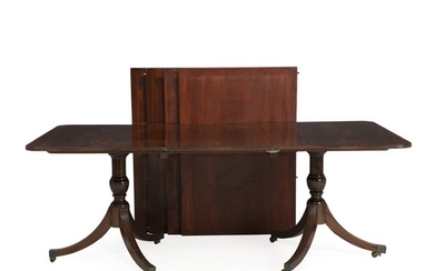A Regency style mahogany Two Pillar Table. England, 20th century. H. 74 cm. L. 144/498 cm. D. 110 cm. (7)