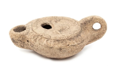 A Roman Style Terracotta Oil Lamp Length 3 1/2 inches.