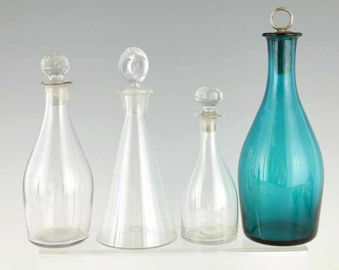 A SELECTION OF FOUR GEORGIAN GLASS DECANTERS of ta