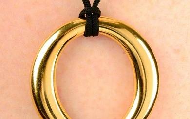 A 'Sevillana' pendant, on black cord, by Elsa Peretti for Tiffany & Co.Stamped 750. Length of