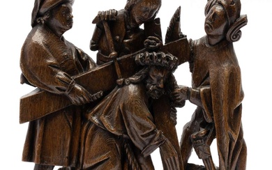 A Southern Netherlands carved oak group of Christ carrying the Cross