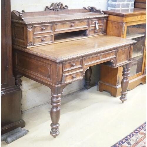 A Victorian carved oak kneehole desk, width 124cm depth 69cm...