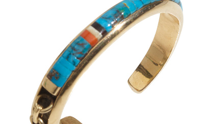 A channel-inlaid 14k gold cuff bracelet