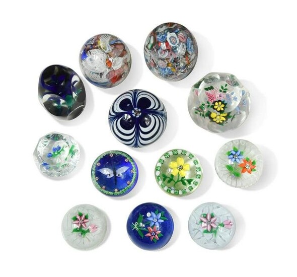 A collection of John Deacons and other glass paperweights