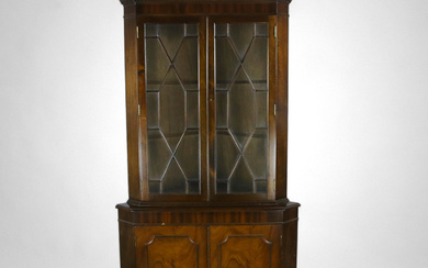 A corner cabinet with mahogany veneer, second half of the 20th century.