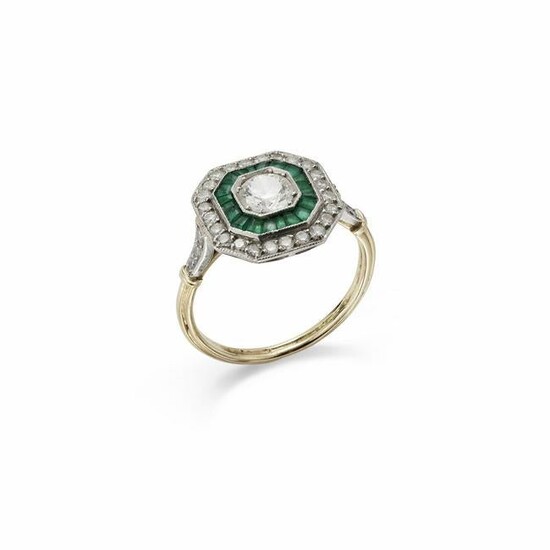 A diamond and emerald target cluster ring