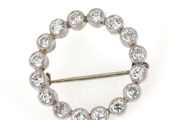 A diamond brooch set with numerous brilliant-cut and old-cut diamonds weighing a...