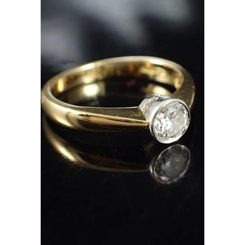 A diamond single stone set in 18ct gold with a valuation fro...