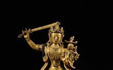 A gilt-copper alloy figure of Manjushri, Qing dynasty, 18th century