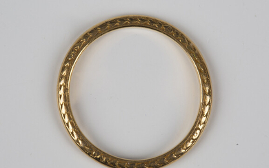 A gold decorated wedding ring, detailed '22ct', weight 2.4g, ring size approx L, with a ca