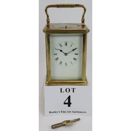 A good quality repeater carriage clock in glazed brass case,...