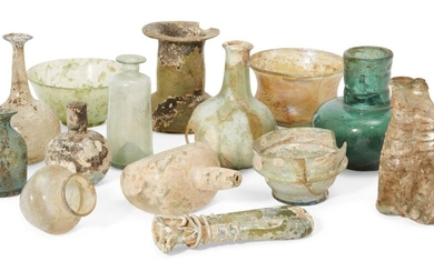 A group of Roman and later glass vessels 1st Century A.D. and Later, including a bottle with spherical body, tall narrow neck and applied trailing around the body, 10cm high, some cracks; a small Roman bowl with collar rim, part of rim missing, 4cm...