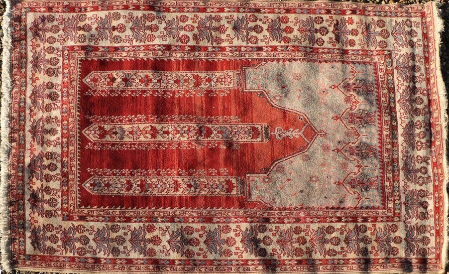 A hand knotted Turkish prayer rug