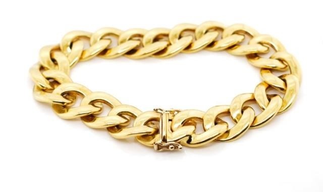 A heavy 18ct yellow gold curb link bracelet marked 750 to bo...
