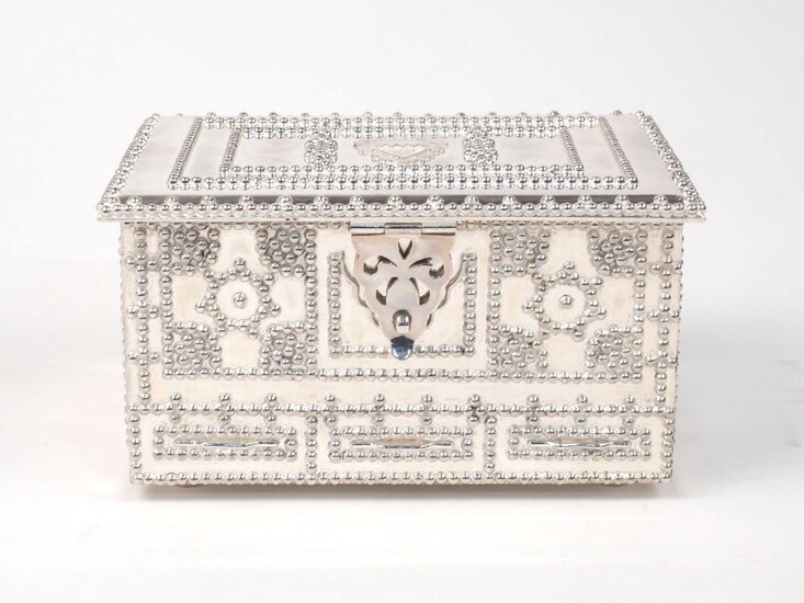 A jewellery box designed as a casket, elaborately decorated with beaded patterns, the lid opening to reveal two red-lined trays for jewellery, 11 x 16 x 8.5cm, in fitted case