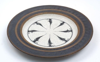 A large contemporary studio ceramic charger, 20th century, with Islamic style wheel motif to the well, maker's mark with date '11/93' and no. '1902' to the reverse, 50cm diameter