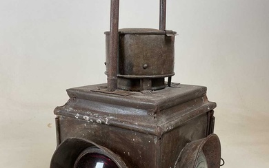 A large vintage railway lamp with four lenses and fixed...