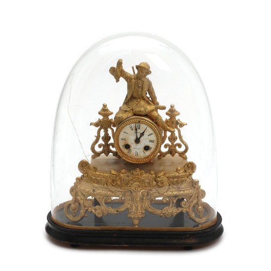 A late 19th century French gilt metal mantel clock, with white enamel...