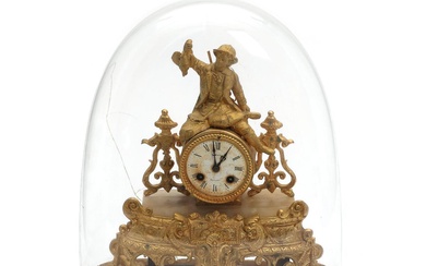 A late 19th century French gilt metal mantel clock, with white enamel...