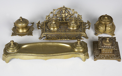A late Victorian cast brass inkstand, decorated with cherubs and foliage, width 25cm, together with