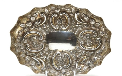 A late Victorian embossed silver tray