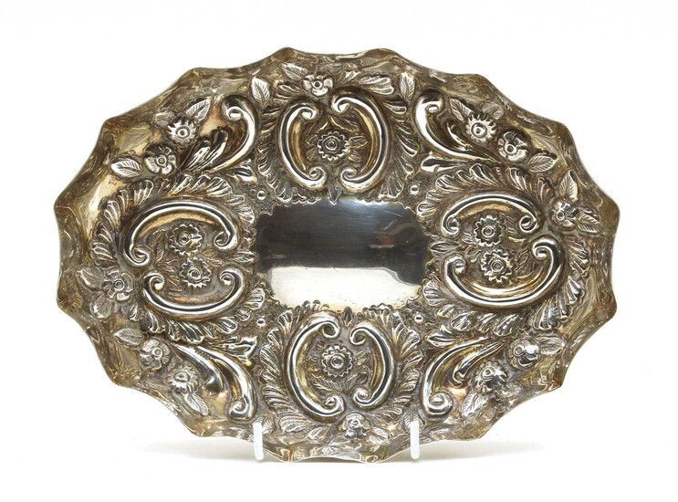 A late Victorian embossed silver tray