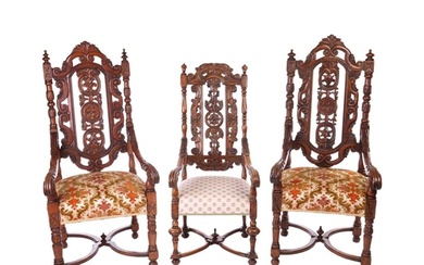 A near pair of Victorian carved oak open armchairs, in the C...