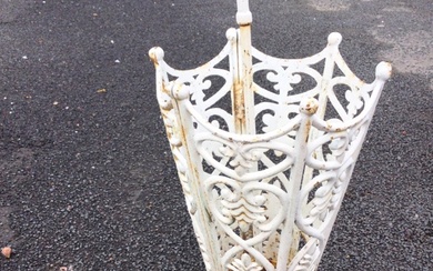A painted cast iron stickstand in the form of an...
