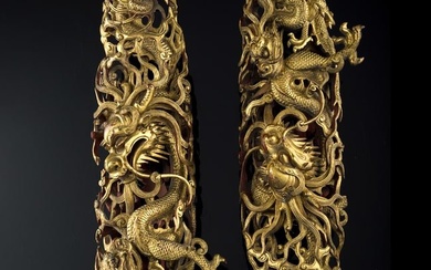 A pair of Chinese carved wood 'dragon' decorations, 18th century