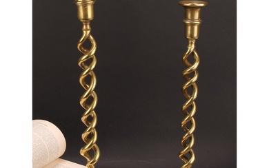 A pair of Victorian brass open-twist table candlesticks, dis...