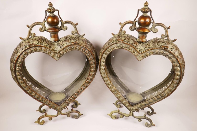 A pair of metal and glass, heart shaped garden candle lanter...