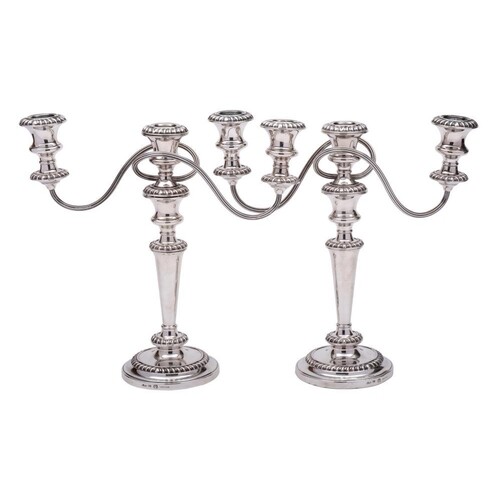A pair of silver plated twin branch candelabra, by Barker El...