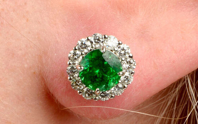 A pair of tsavorite garnet and brilliant-cut diamond cluster earrings.