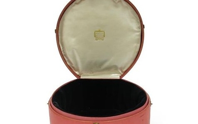 A pink leather tiara case by Cartier, with...