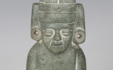 A pre-Columbian style carved green hardstone duality figure, modelled to both sides representing lif