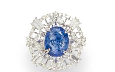 A sapphire, diamond and fourteen karat white gold ring