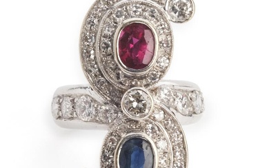 A sapphire, ruby and diamond ring set with an oval-cut sapphire, an...