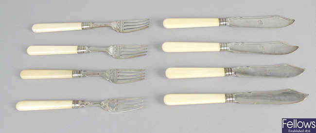 A set of six Victorian ivory-handled silver butter knives and side forks