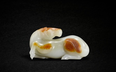 A white and russet jade recumbent horse, Qing dynasty, 19th...