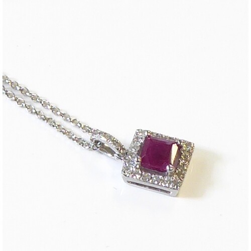 A white-gold, ruby and diamond cluster pendant and chain